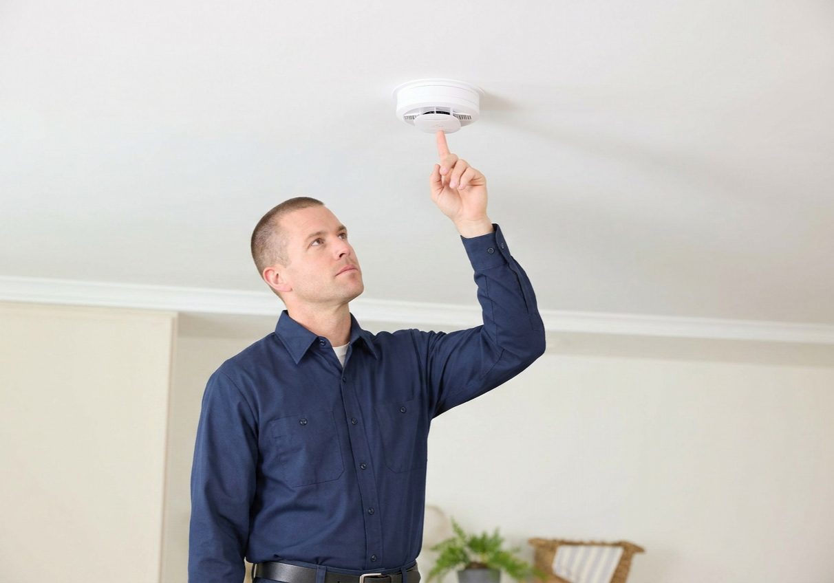 HVAC-Technician-Testing-Smoke-Detector